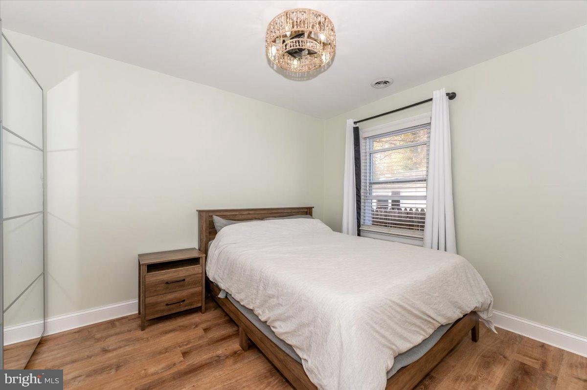 1306 3rd Road Middle River, MD 21220 - Photo 32 of 60 Serene bedroom with natural light and charm.