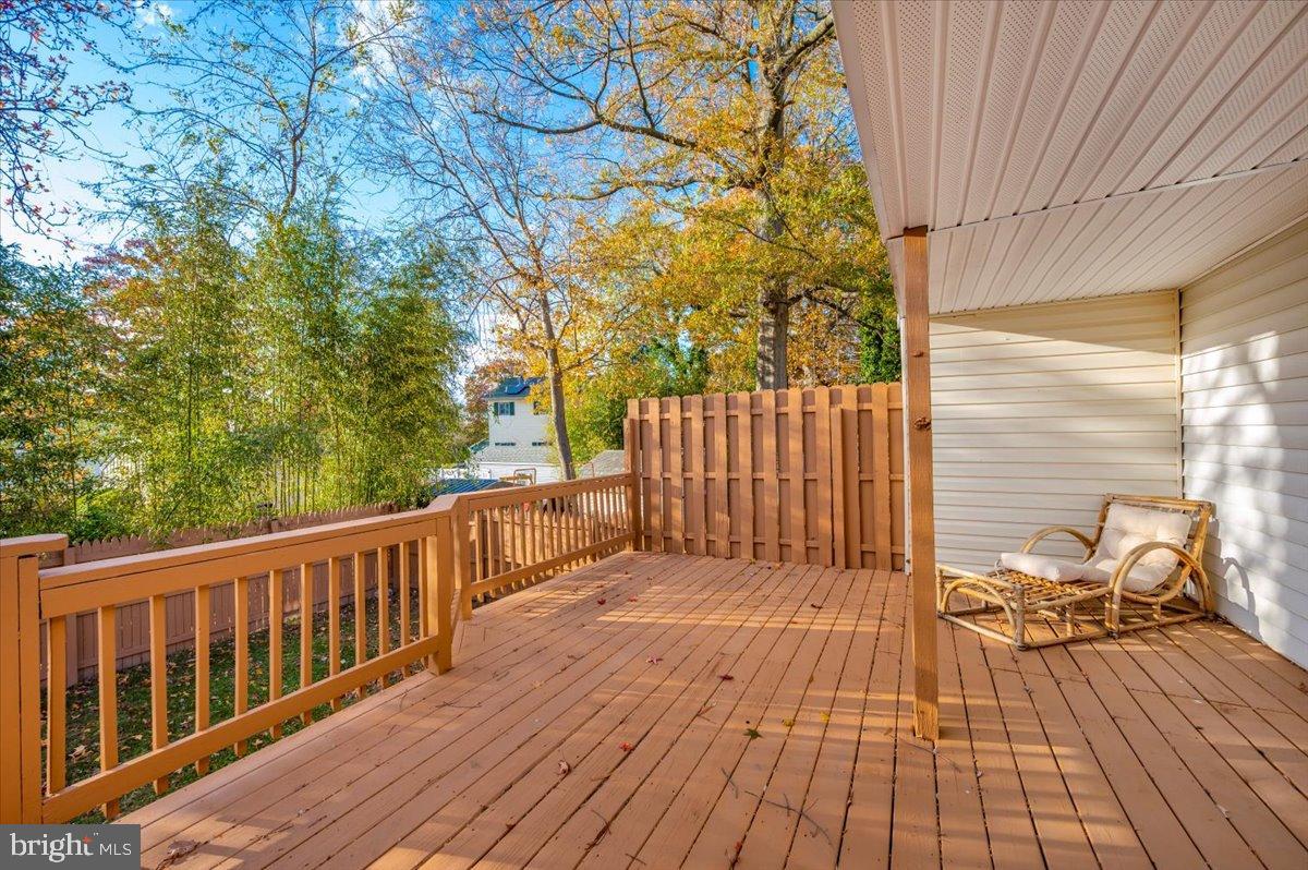 1306 3rd Road Middle River, MD 21220 - Photo 43 of 60 Sunny deck surrounded by vibrant foliage.