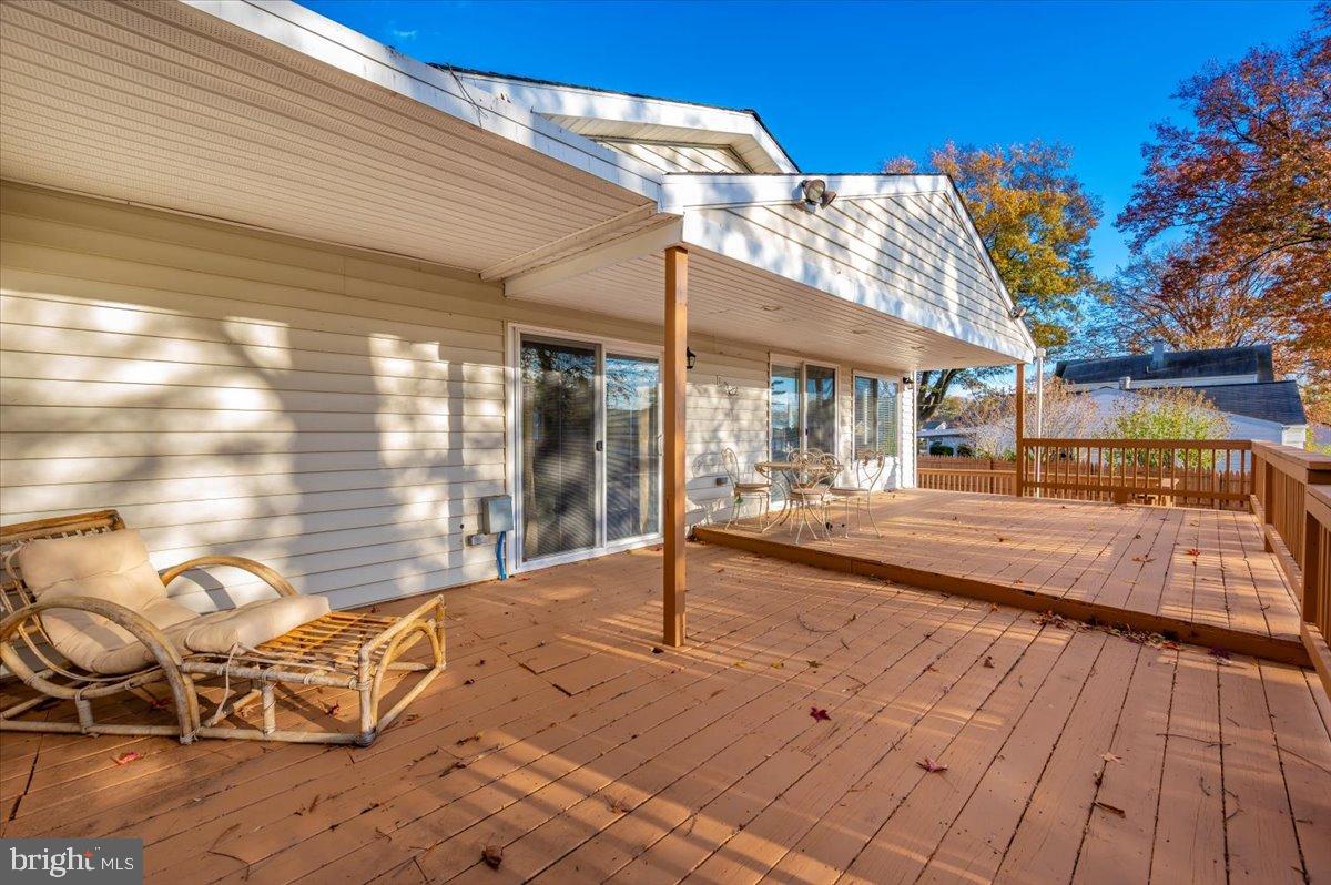 1306 3rd Road Middle River, MD 21220 - Photo 44 of 60 Spacious deck with serene outdoor views.