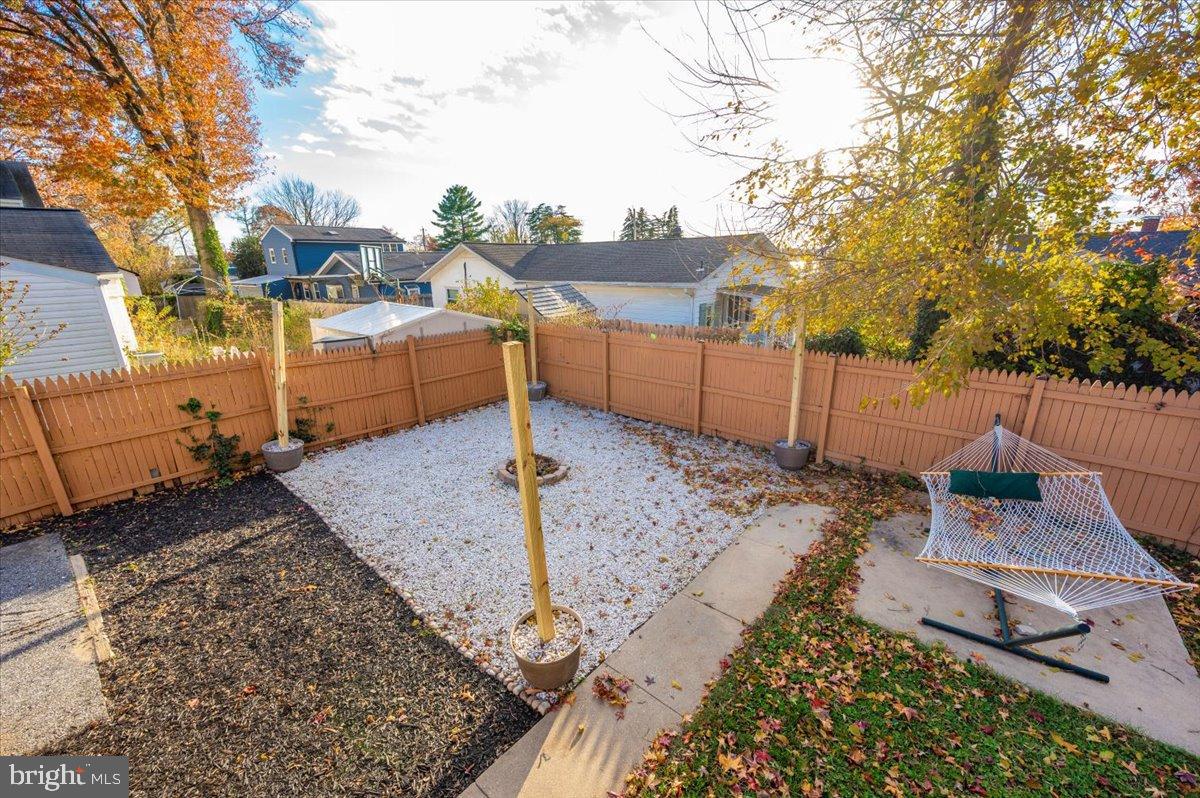 1306 3rd Road Middle River, MD 21220 - Photo 45 of 60 Serene backyard oasis with cozy charm.