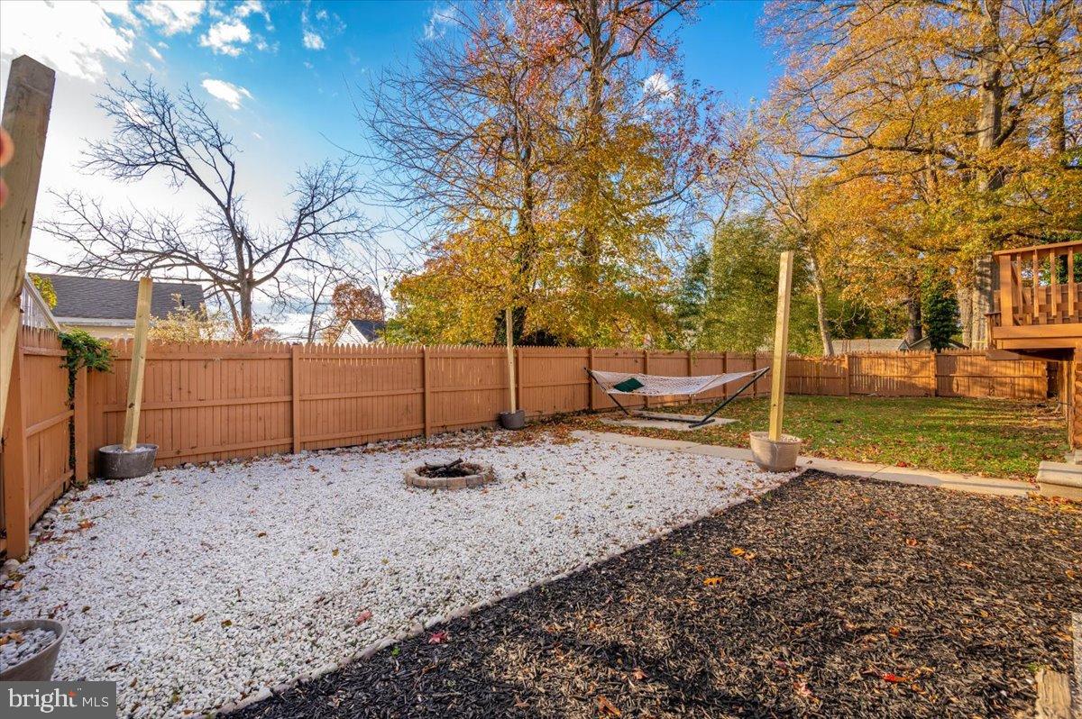1306 3rd Road Middle River, MD 21220 - Photo 47 of 60 Serene backyard retreat with autumn hues.
