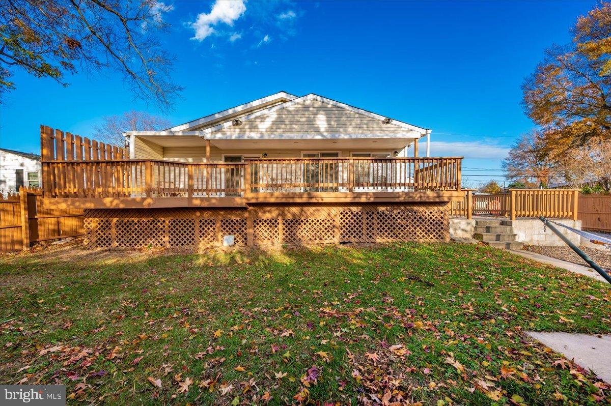 1306 3rd Road Middle River, MD 21220 - Photo 50 of 60 Spacious deck overlooking a serene backyard.