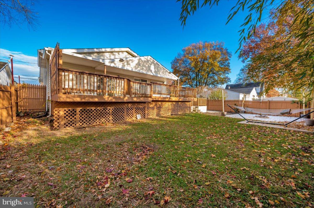 1306 3rd Road Middle River, MD 21220 - Photo 51 of 60 Charming backyard retreat with vibrant foliage.