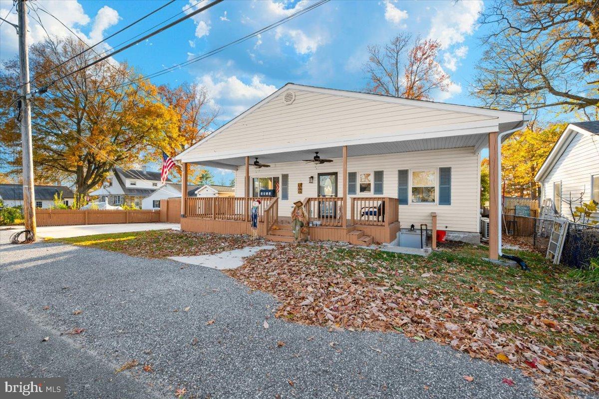 1306 3rd Road Middle River, MD 21220 - Photo 55 of 60 Charming home with inviting porch and autumn hues.