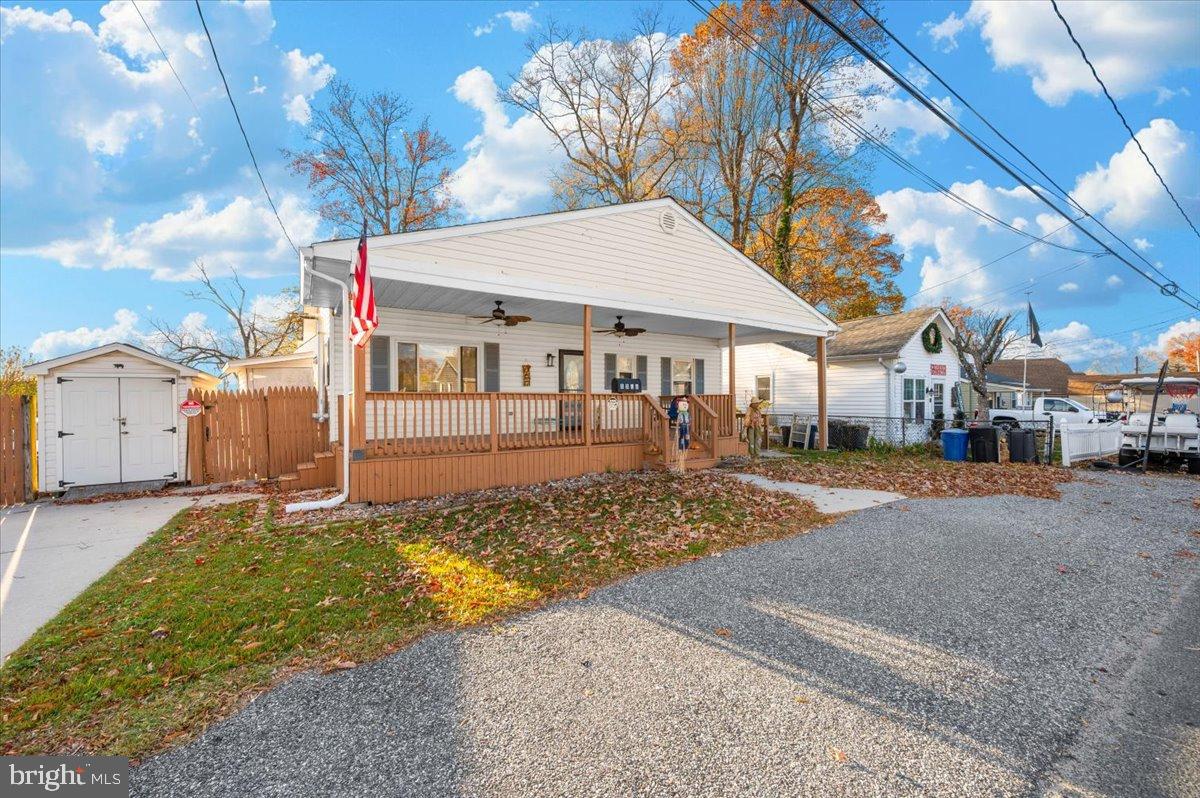 1306 3rd Road Middle River, MD 21220 - Photo 56 of 60 Charming home with inviting porch and greenery.