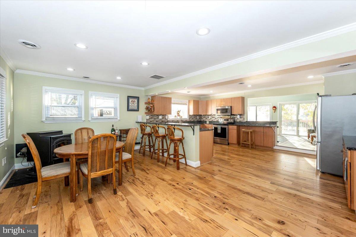 1306 3rd Road Middle River, MD 21220 - Photo 9 of 60 Spacious kitchen with warm wooden floors.