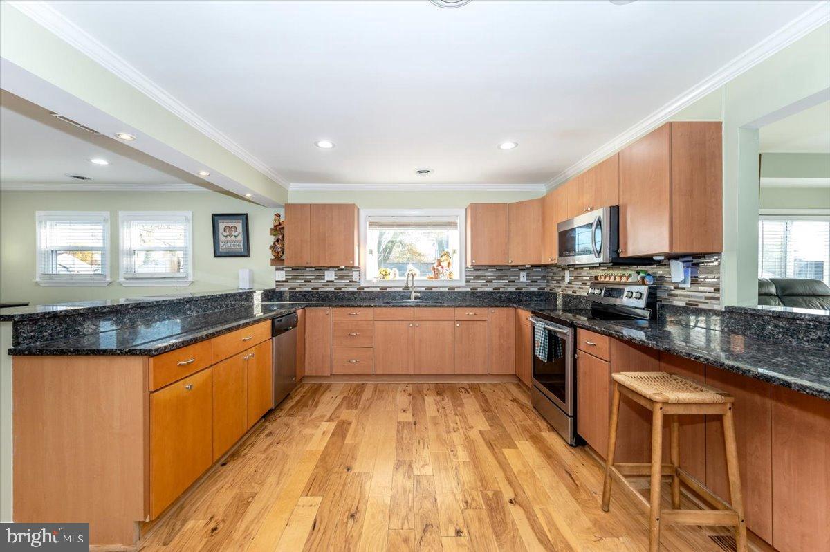 1306 3rd Road Middle River, MD 21220 - Photo 10 of 60 Modern kitchen with sleek finishes.