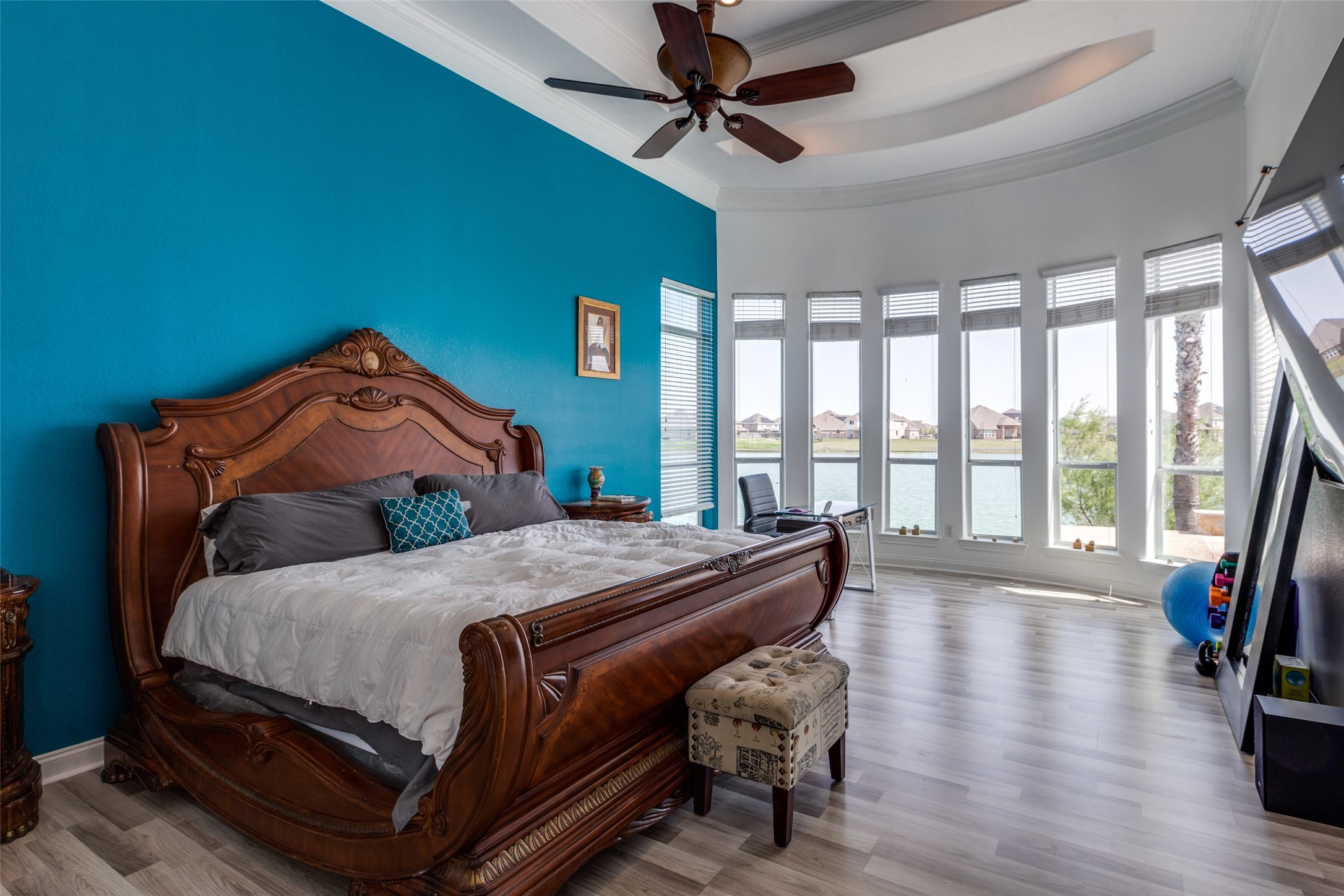 8 Cypress Point Court Manvel, TX 77578 - Photo 11 of 20 a bedroom with a bed and wooden floor