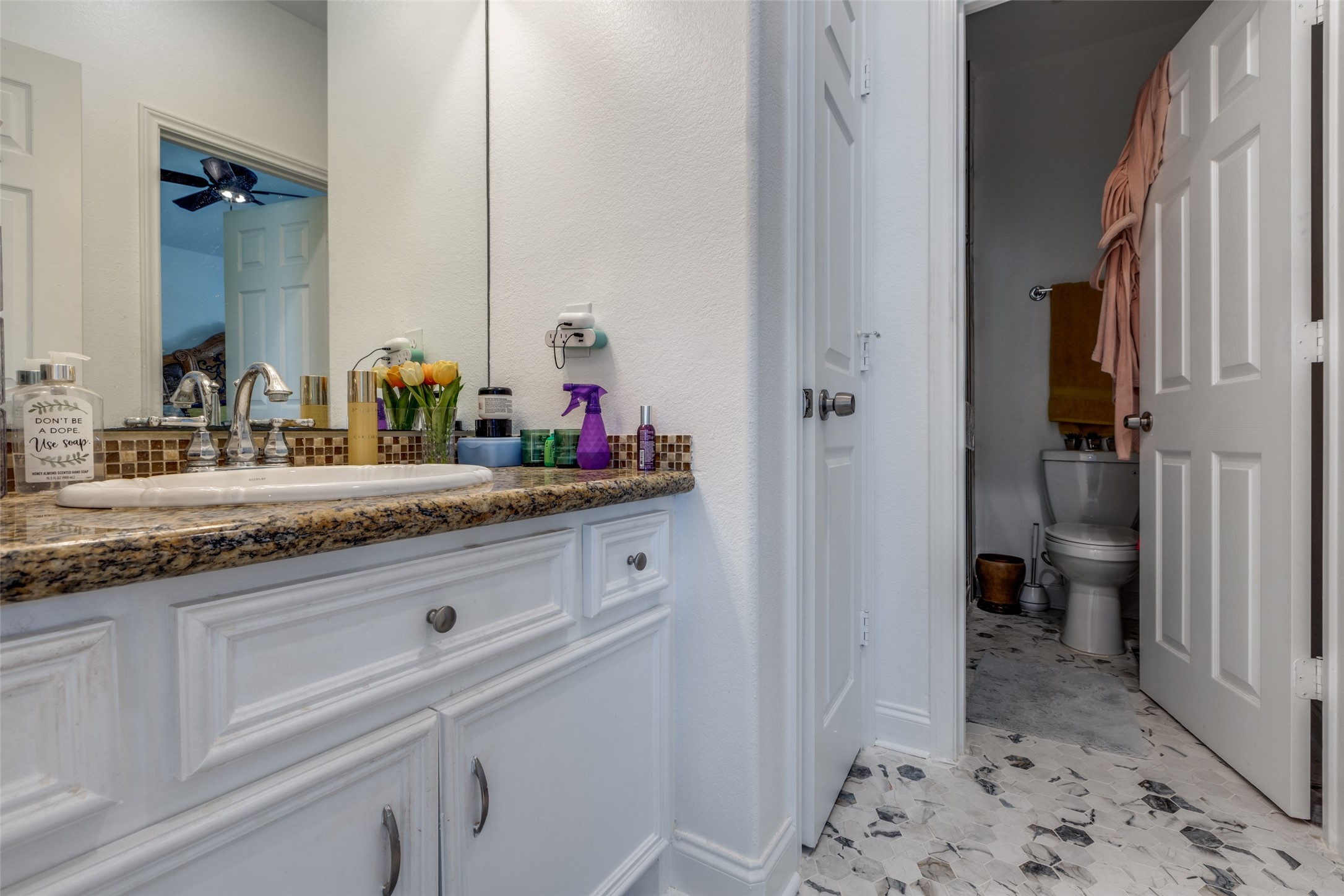8 Cypress Point Court Manvel, TX 77578 - Photo 15 of 20 a bathroom with a sink and a mirror