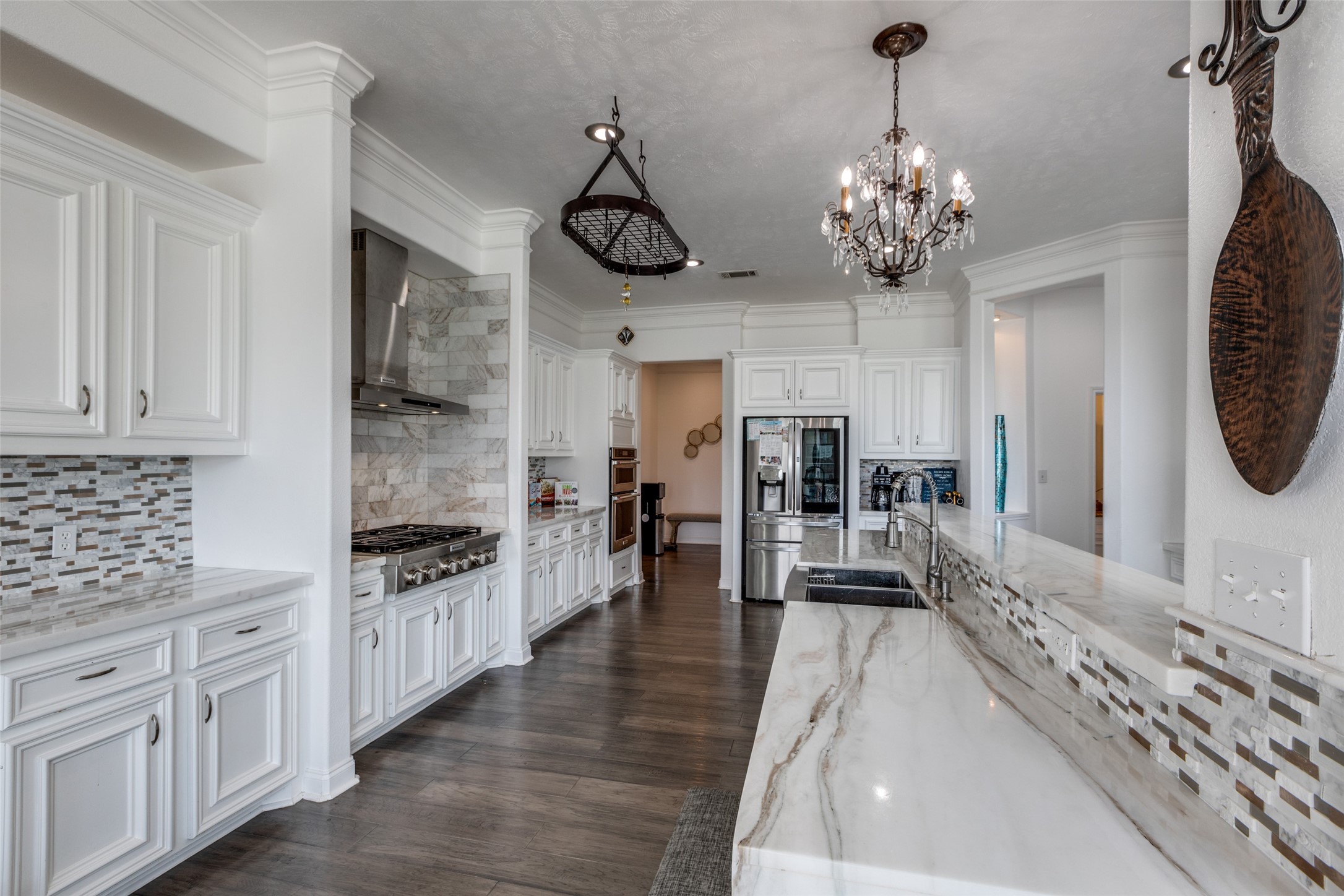 8 Cypress Point Court Manvel, TX 77578 - Photo 4 of 20 a view of a kitchen with sink microwave and cabinets