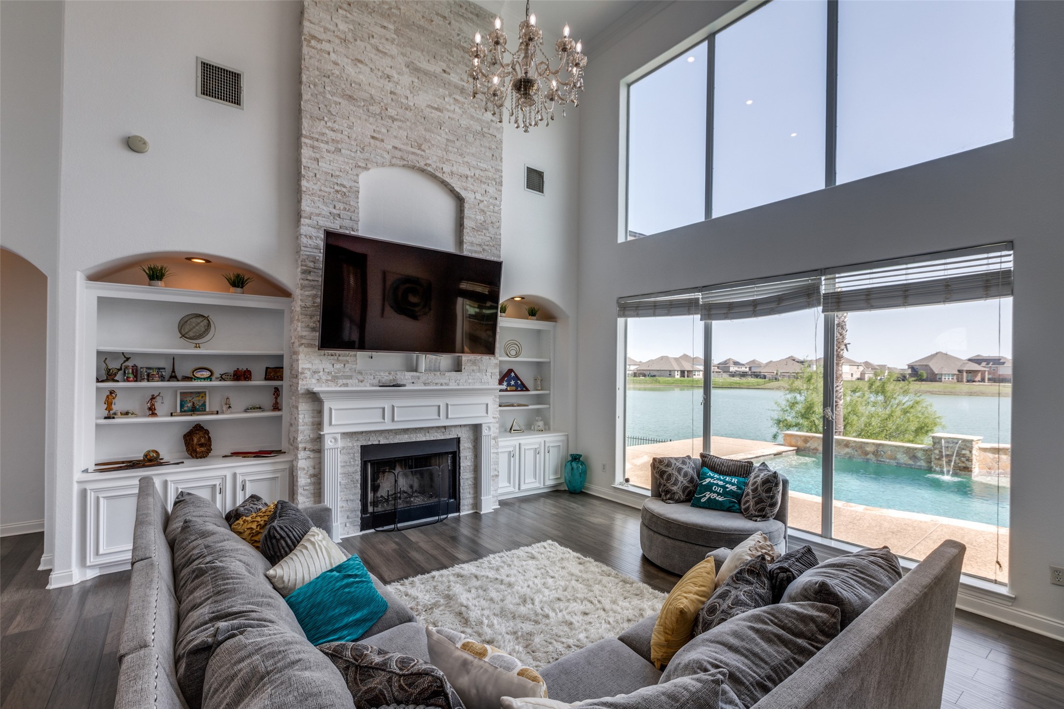 8 Cypress Point Court Manvel, TX 77578 - Photo 6 of 20 a living room with furniture fireplace and flat screen tv