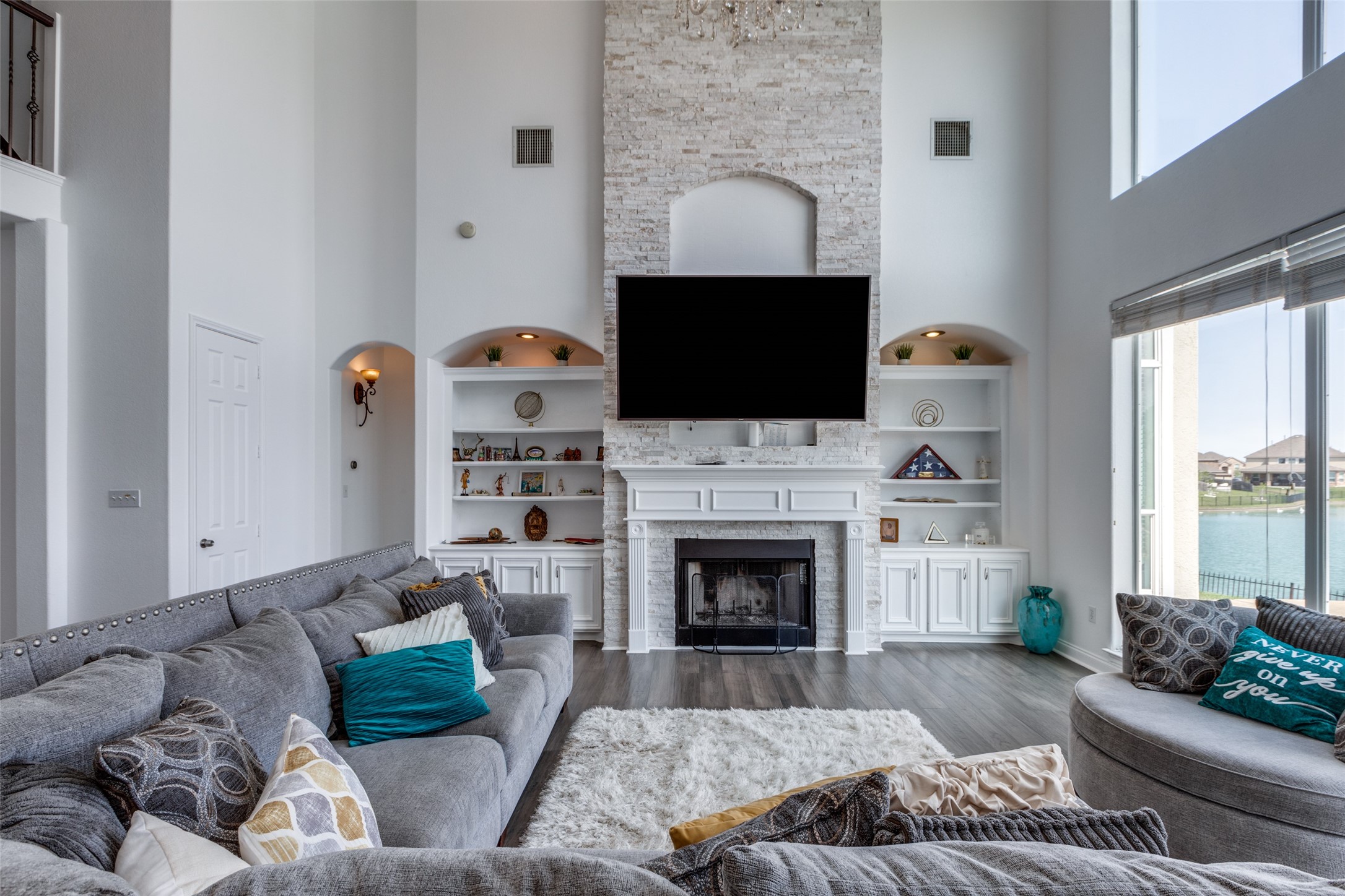 8 Cypress Point Court Manvel, TX 77578 - Photo 7 of 20 a living room with furniture a fireplace and a flat screen tv