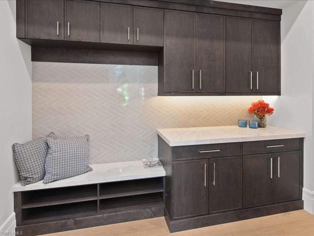 292 Bahia Point Naples, FL 34103 - Photo 12 of 50 a bathroom with a sink and cabinets