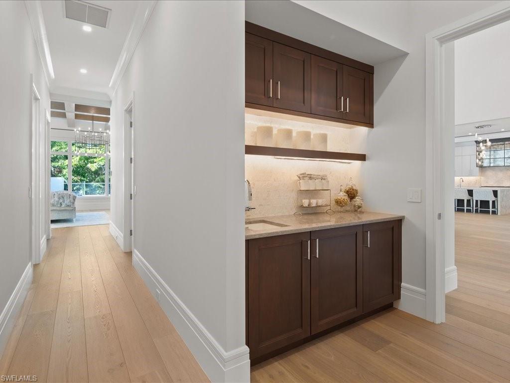 292 Bahia Point Naples, FL 34103 - Photo 13 of 50 a bathroom with a sink and a mirror