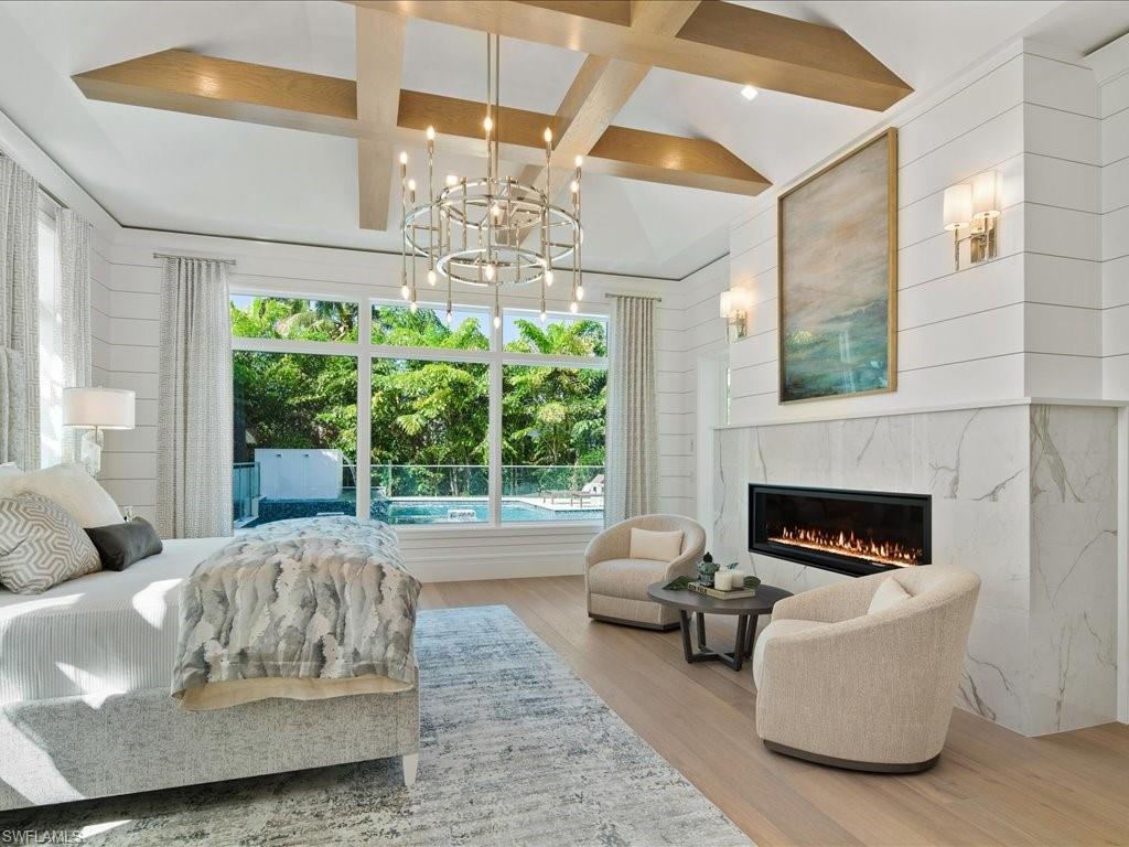 292 Bahia Point Naples, FL 34103 - Photo 14 of 50 a living room with furniture and a fireplace