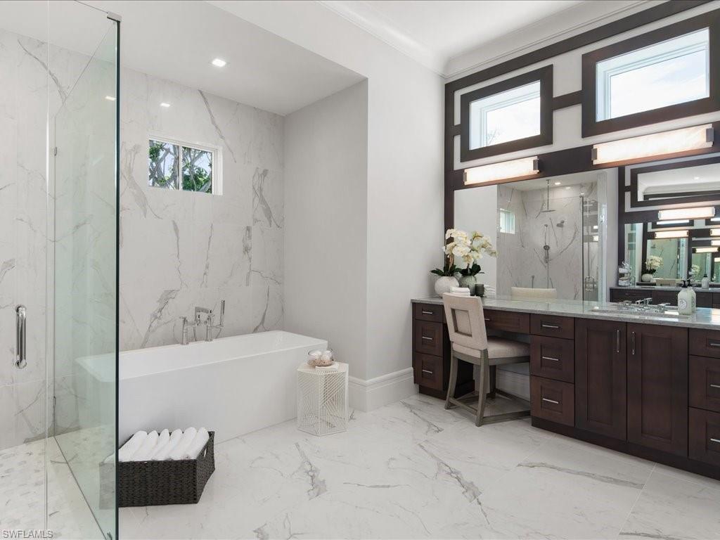 292 Bahia Point Naples, FL 34103 - Photo 18 of 50 a bathroom with a bathtub shower sink and toilet