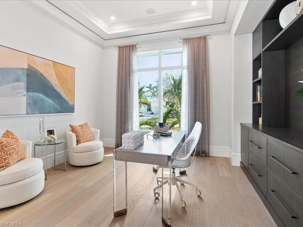 292 Bahia Point Naples, FL 34103 - Photo 20 of 50 a living room with furniture and a flat screen tv