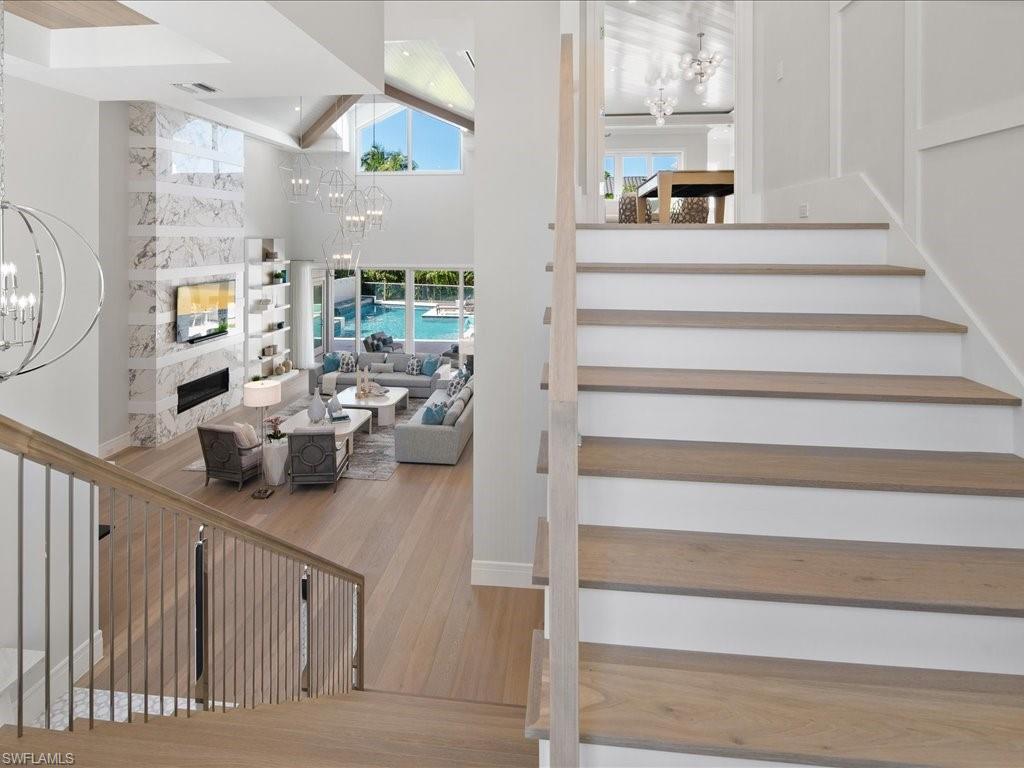 292 Bahia Point Naples, FL 34103 - Photo 27 of 50 a view of living room with furniture and a chandelier