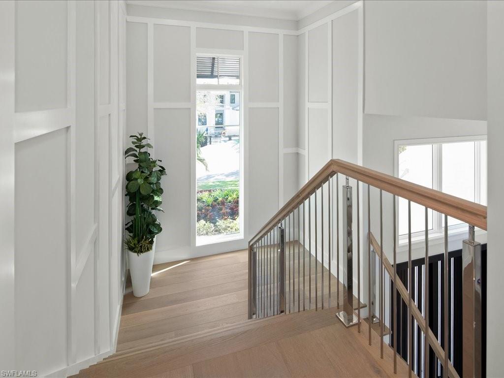 292 Bahia Point Naples, FL 34103 - Photo 28 of 50 a view of entryway with wooden floor and stairs