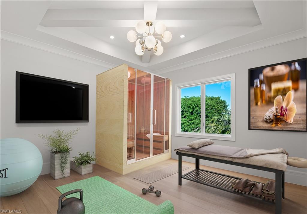 292 Bahia Point Naples, FL 34103 - Photo 33 of 50 a living room with furniture a flat screen tv and a large window