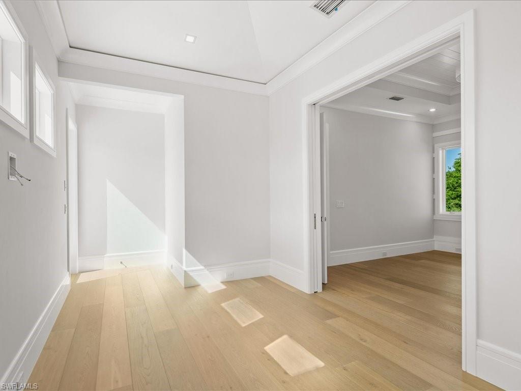 292 Bahia Point Naples, FL 34103 - Photo 37 of 50 wooden floor in an empty room with a window
