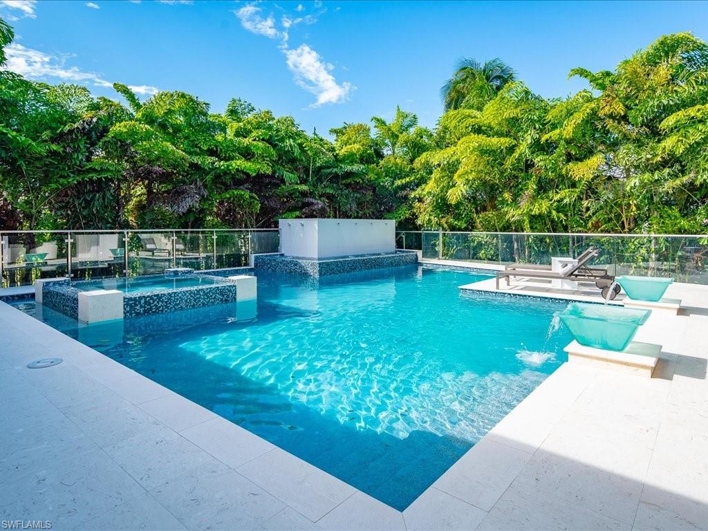 292 Bahia Point Naples, FL 34103 - Photo 39 of 50 a view of a swimming pool with a patio