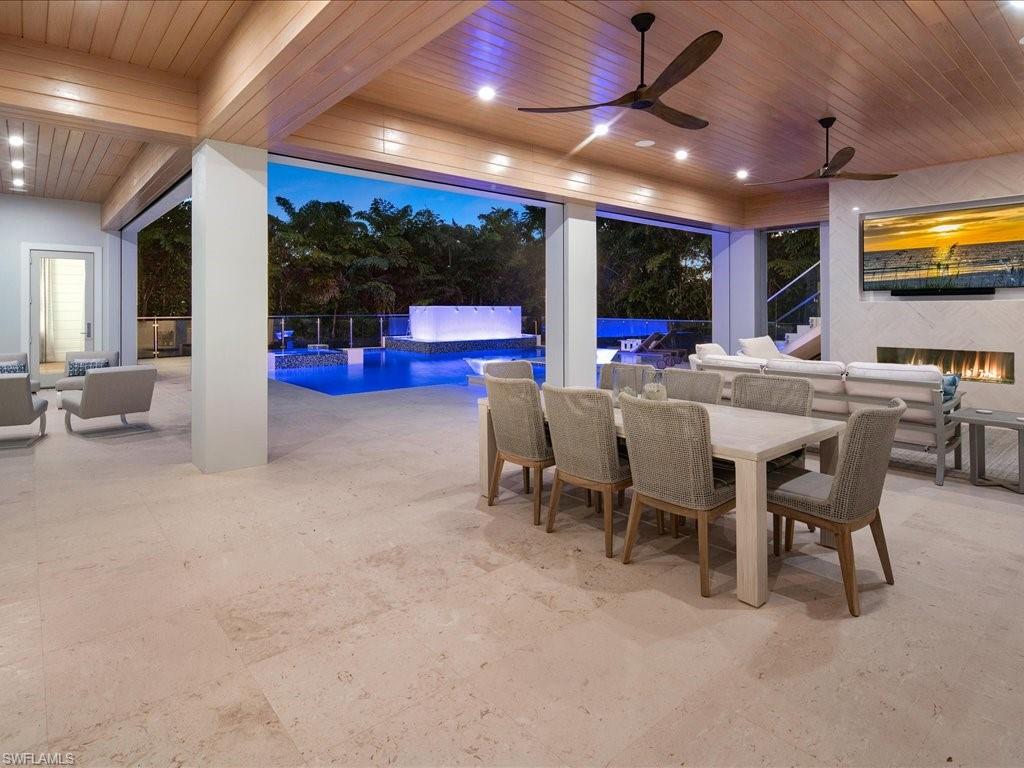 292 Bahia Point Naples, FL 34103 - Photo 42 of 50 a view of a dining room with furniture window and outside view