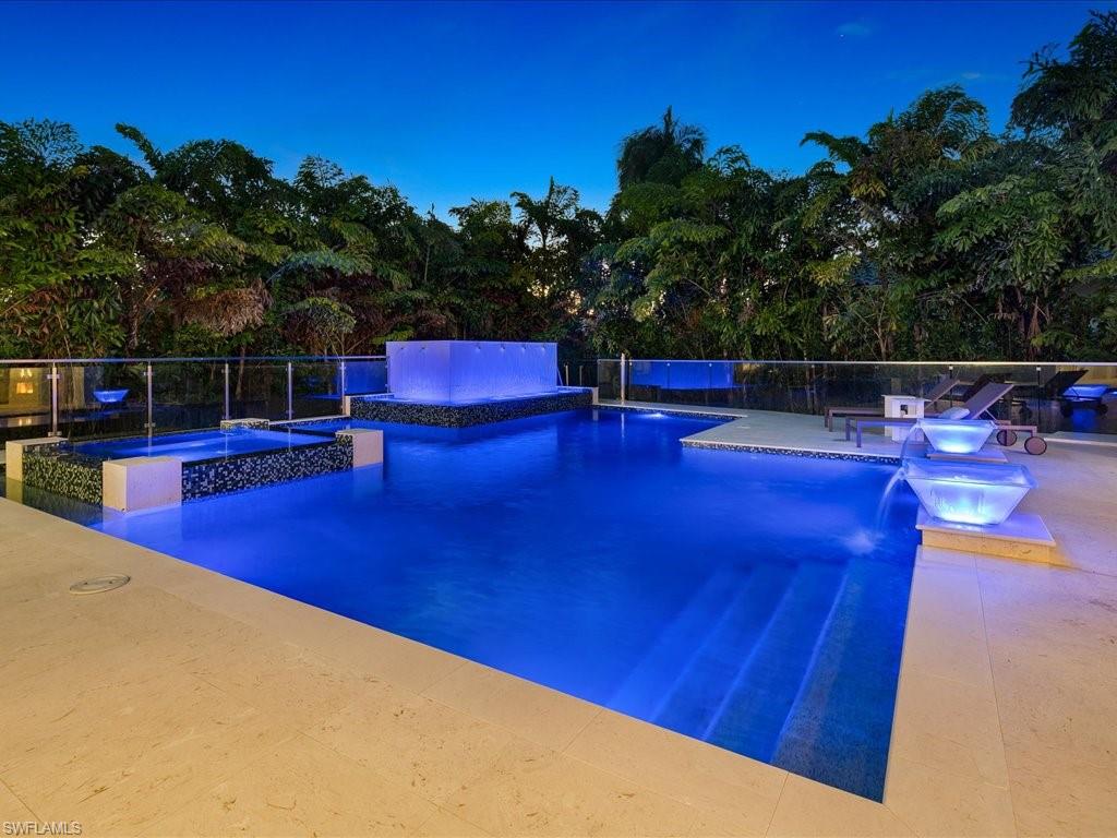 292 Bahia Point Naples, FL 34103 - Photo 45 of 50 a view of a swimming pool with a patio