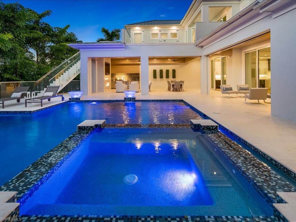 292 Bahia Point Naples, FL 34103 - Photo 47 of 50 a room with pool table and couches chair with swimming pool