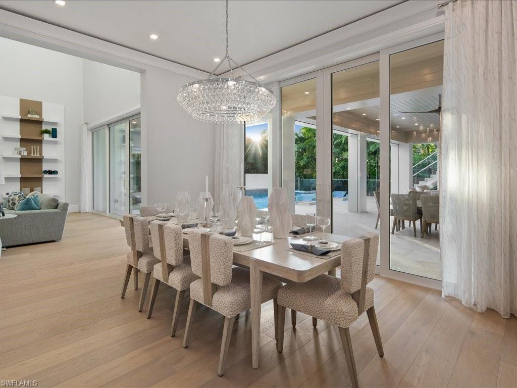 292 Bahia Point Naples, FL 34103 - Photo 6 of 50 a view of a dining room with furniture window and outside view