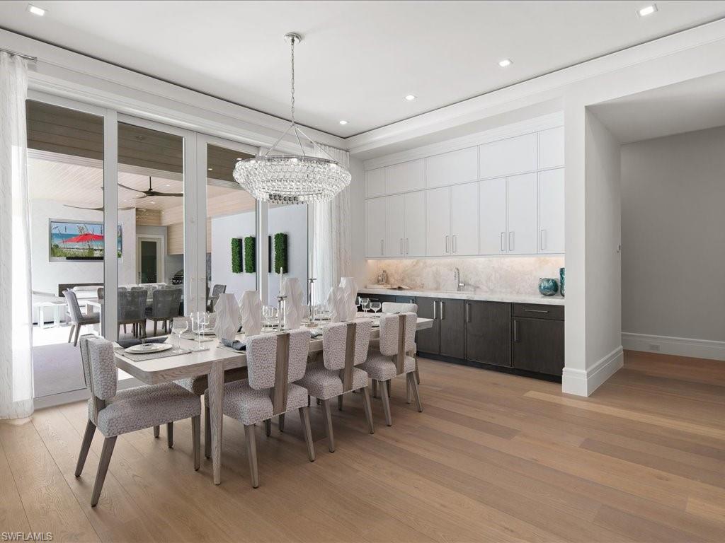 292 Bahia Point Naples, FL 34103 - Photo 7 of 50 a view of a dining room with furniture