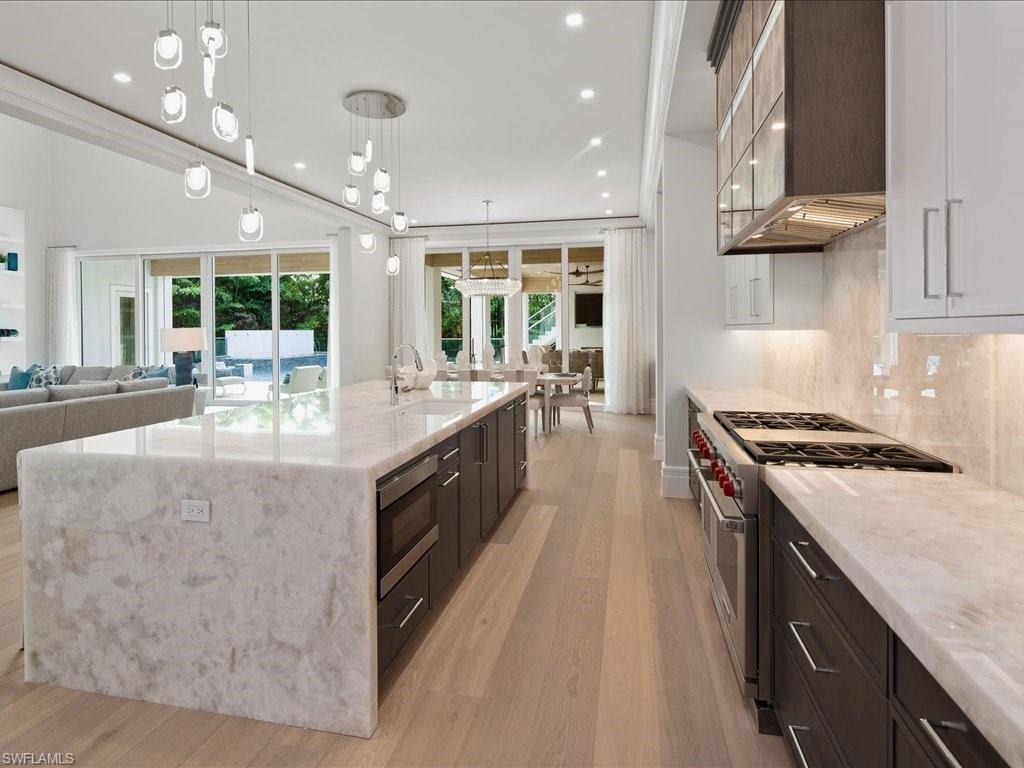 292 Bahia Point Naples, FL 34103 - Photo 8 of 50 a large kitchen with kitchen island a large island in it