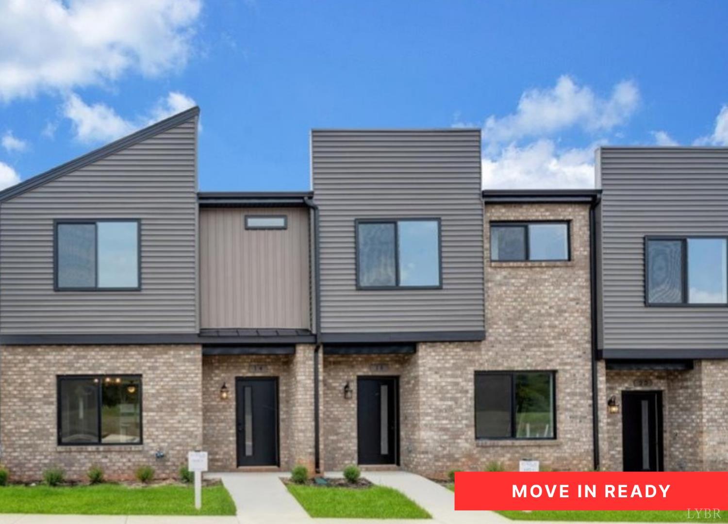 a front view of building with yard