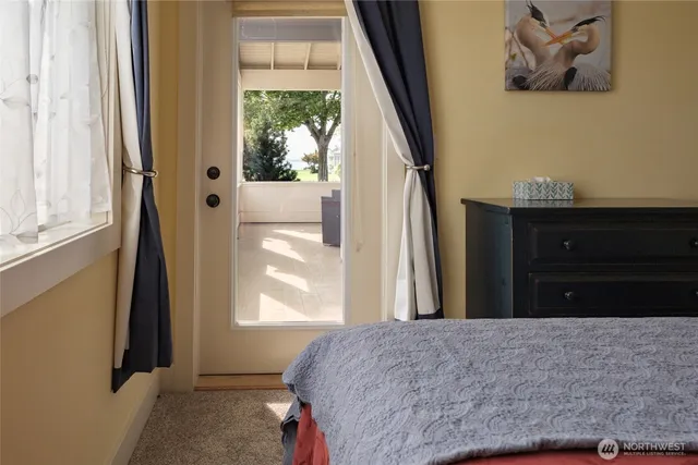 a bedroom with a bed and cabinets