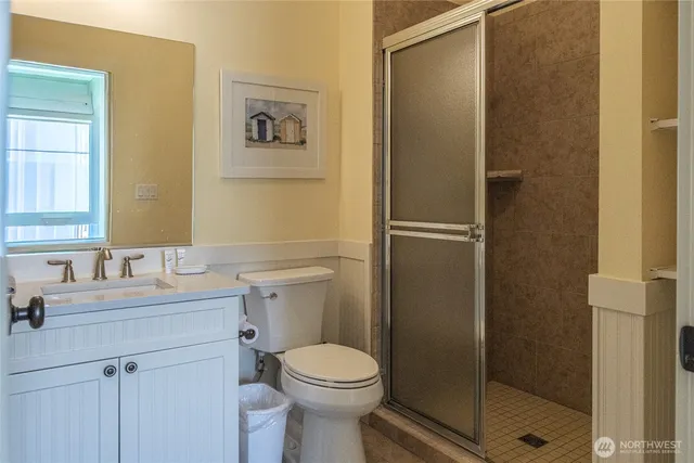 a bedroom with two beds and a window