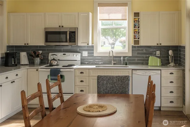 a bathroom with a sink and a window