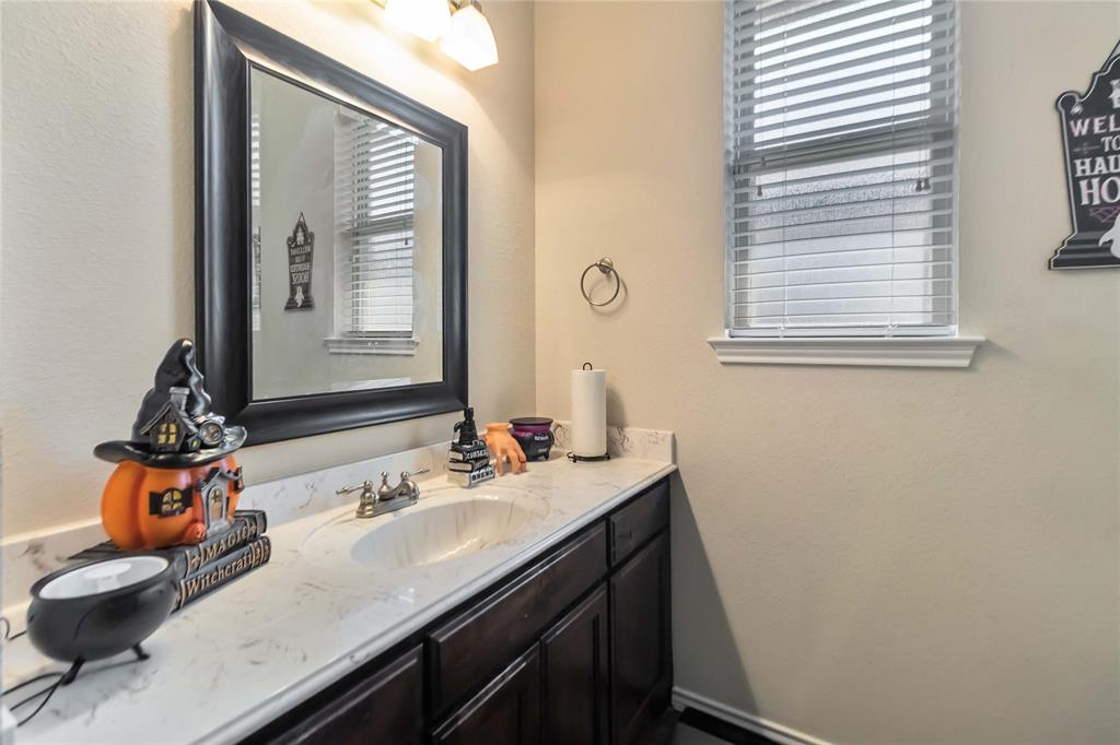 1663 Fraser Drive Burleson, TX 76028 - Photo 5 of 22 Bathroom featuring vanity and a textured wall