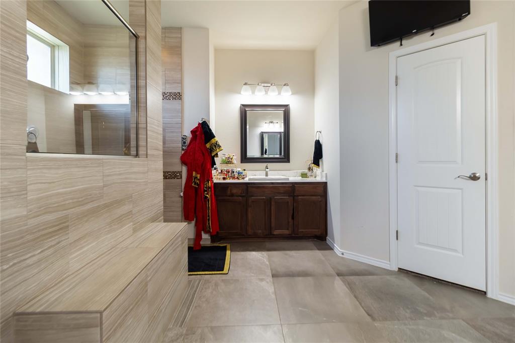 1663 Fraser Drive Burleson, TX 76028 - Photo 9 of 22 Bathroom with walk in shower, vanity, and light tile patterned floors