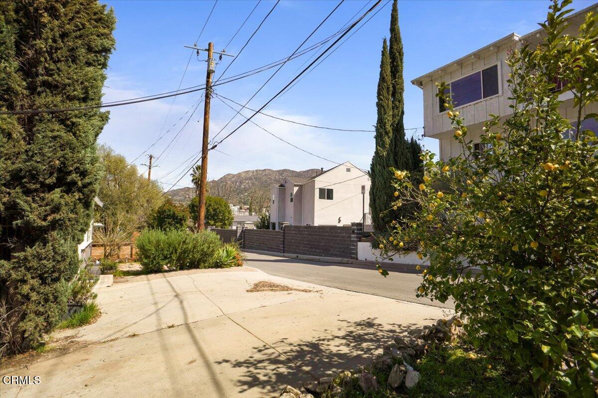 9747 Pinewood Avenue Tujunga, CA 91042 - Photo 2 of 2 a view of a house with a yard