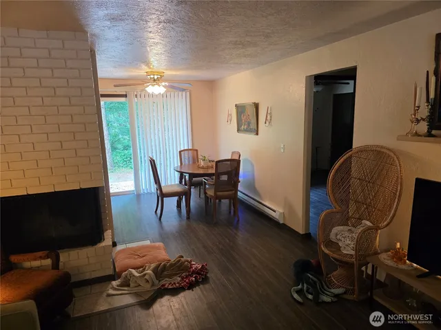 a view of a livingroom with furniture and a flat screen tv