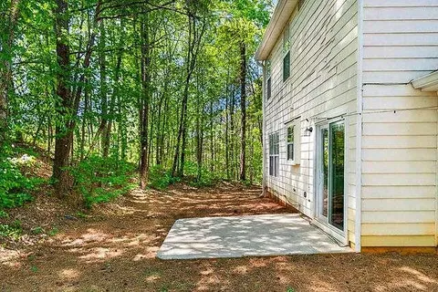 a view of backyard with green space