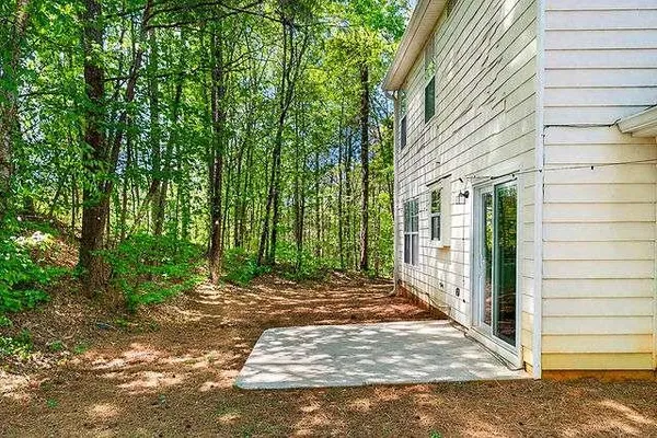 a view of backyard with green space