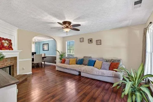 a living room with furniture and a fireplace