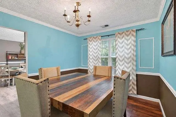 a view of a dining room with furniture window and outside view