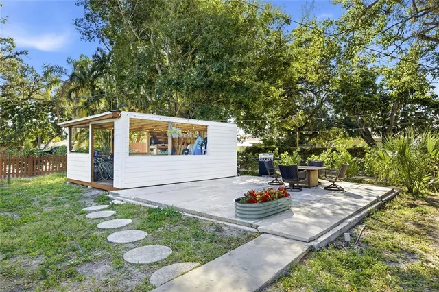 a front view of house with yard outdoor seating and green space