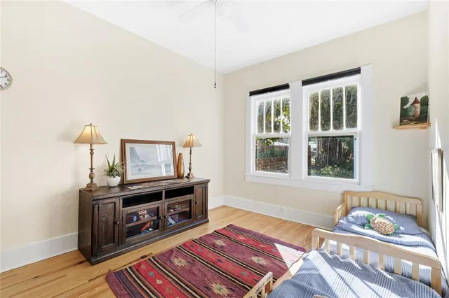 a bedroom with furniture and a window