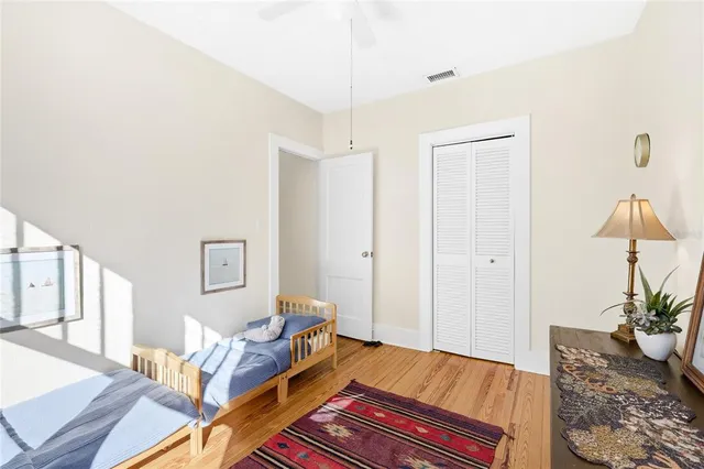 a bedroom with furniture and a potted plant