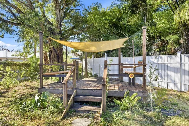 a view of a chairs and table in the patio