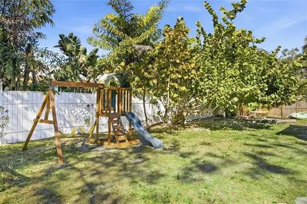 a view of a yard with a tree