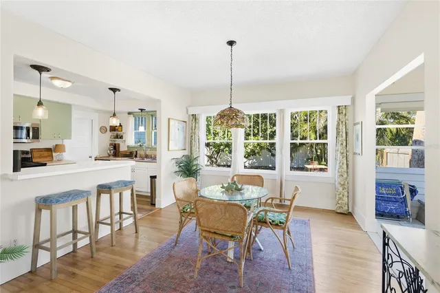 a view of a dining room with furniture window and outside view